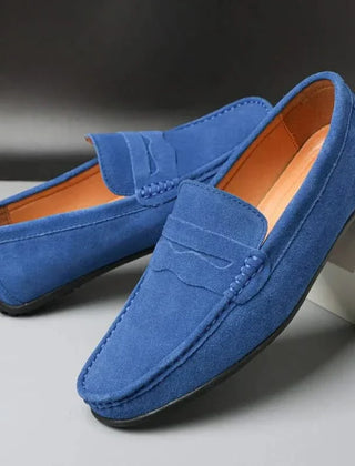 Blue suede slip-on loafers with stitched penny strap and moc toe