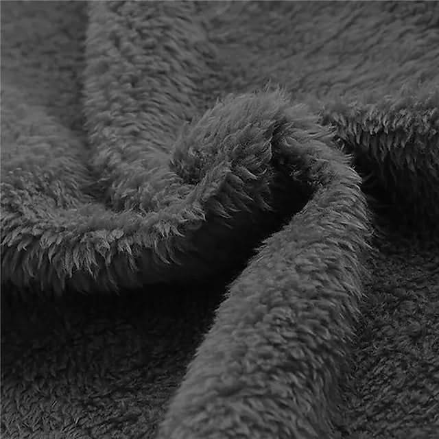 Textured dark grey plush fabric close-up