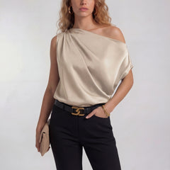 Champagne one-shoulder satin blouse with draped neckline and short sleeve
