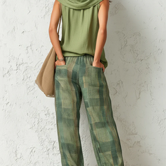 Back view: olive sleeveless cowl tunic with green plaid wide-leg pants, relaxed set