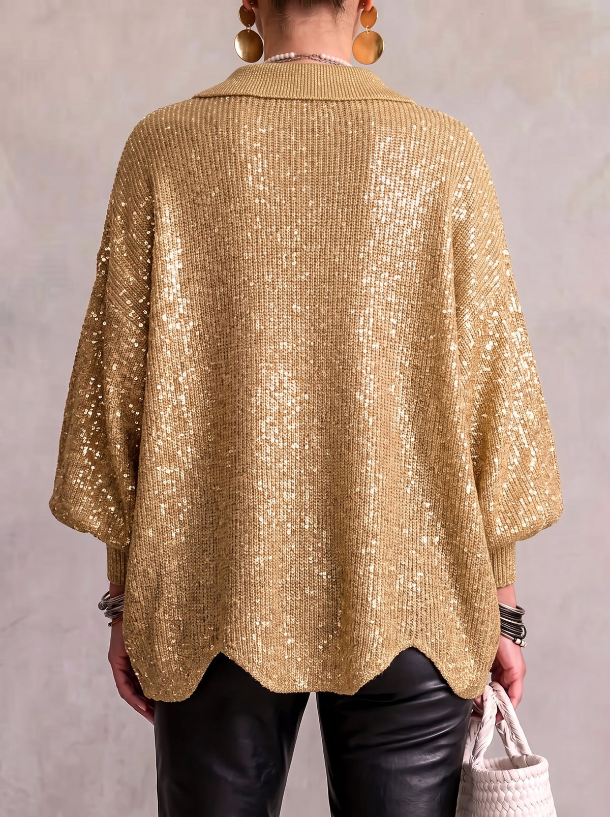 Back view of oversized gold sequin collared button cardigan with 3/4 balloon sleeves