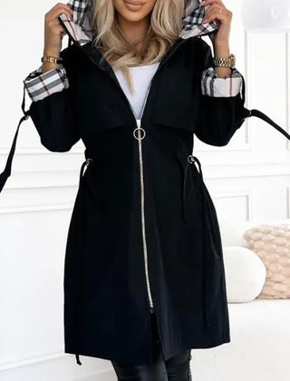 Women's black hooded waterproof jacket with front zipper and adjustable cuffs