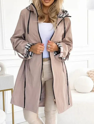 Women's taupe hooded parka with plaid hood lining and long drawcord ties