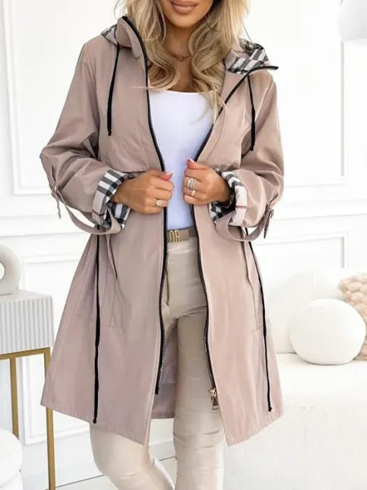 Women's taupe hooded parka with plaid hood lining and long drawcord ties