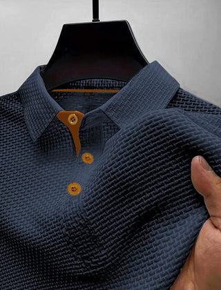 Dark blue textured polo shirt with brown-button placket and short sleeves