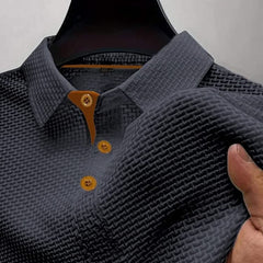Dark grey textured polo shirt with brown-button placket and short sleeves
