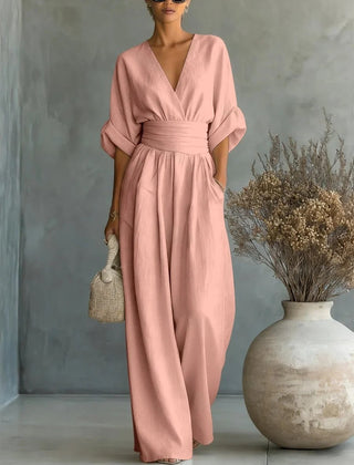 Blush pink V-neck high-waisted jumpsuit with draped sleeves and wide-leg fit
