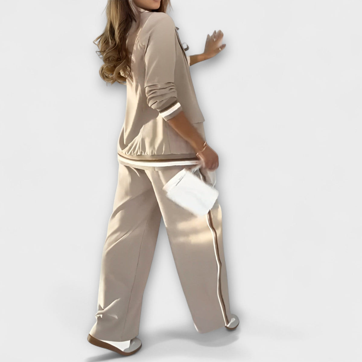 Beige pantsuit set with matching blazer and wide-leg trousers plus side stripe accents.