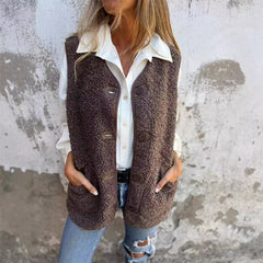 Etta women’s short warm vest in dark brown, button-front with flap pockets.