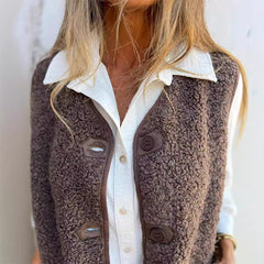 Etta women’s dark brown sherpa vest, button-front and chest pocket details.