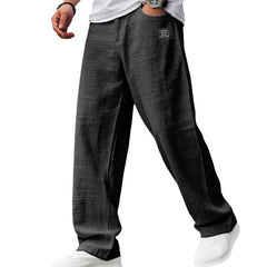 Black casual fit pants with wide straight legs and elasticized waistband
