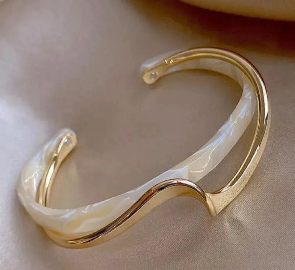 Gold-tone opal stone bracelet with iridescent curved inlay