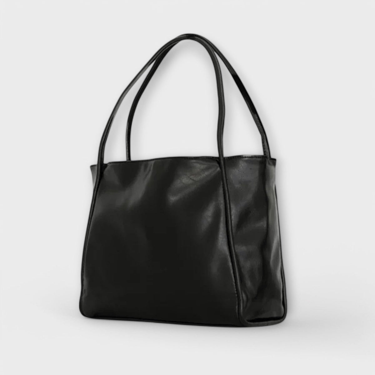 Black leather-look tote bag with wide handles and smooth front panel