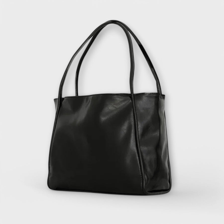 Black leather-look tote bag with wide handles and smooth front panel